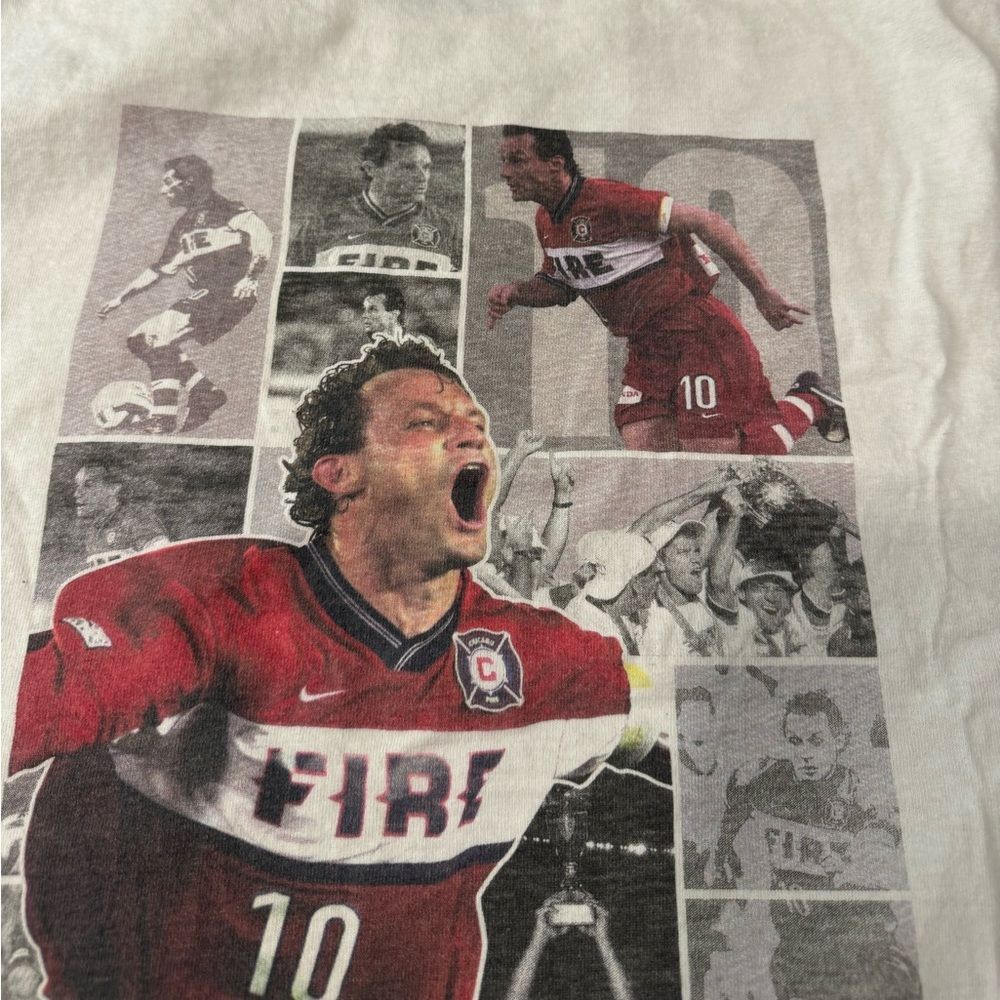 White Peter Nowak Soccer Academy tshirt signed by Peter Nowak. Size XL